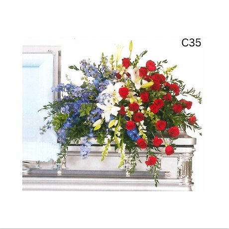 Shades of Blue, White and Red Elegant Casket Spray