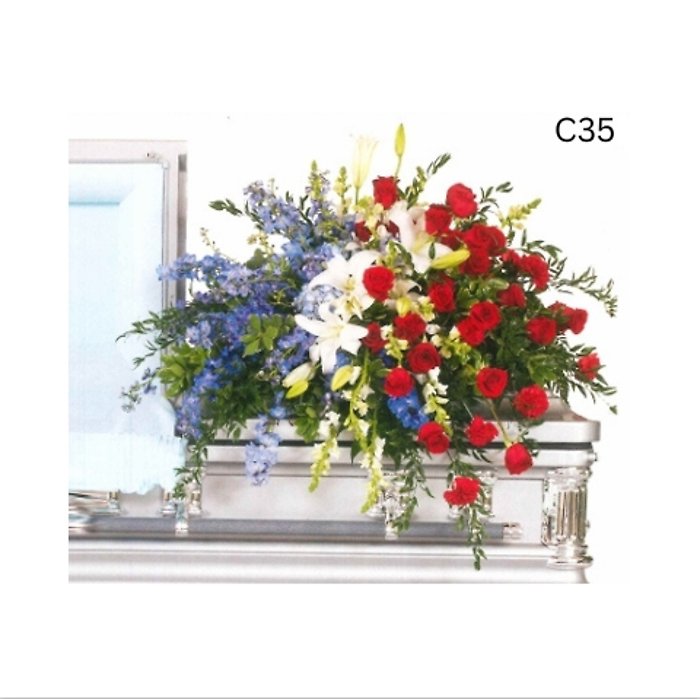 Shades of Blue, White and Red Elegant Casket Spray