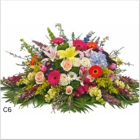 Bold Spring Bloom Casket Spray