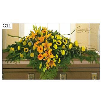 Orange Hue Lilies and Sunflowers Casket Spray